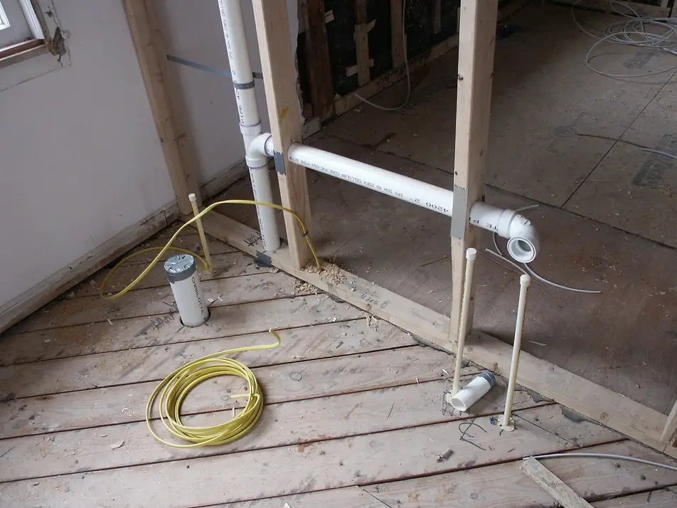 Rough-in plumbing during construction